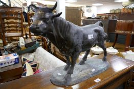 A reproduction bronze style sculpture of bull, the base signed, 55cm