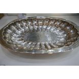 A large sterling silver oval tray of hammered design with reeded decoration, stamped 925, Mexico Alf