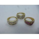 Three 9ct yellow gold dress rings including Greek key design diamond chips, ruby and diamond ring an