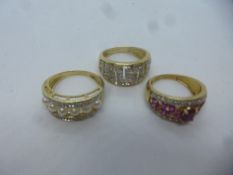 Three 9ct yellow gold dress rings including Greek key design diamond chips, ruby and diamond ring an