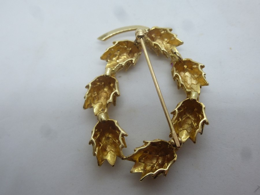 Unmarked yellow metal oval brooch in the form of pine cone wreath separated with rubies, approx 5cm, - Image 2 of 2