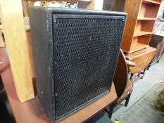 A Peavey Combo 115 amplification system and a pair of corner speakers