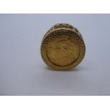 9ct yellow gold ring with mounted 1911 half sovereign, band marked 375, 9.1g approx, size Q