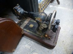 A cased Singer sewing machine F9237846 and a Remington vintage typewriter and box of chinaware to in