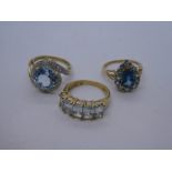 Three 9ct yellow gold dress rings, one set with circular pale blue stone in crossover setting, 9g ap