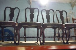 Set of four dining chairs with blue leaf seats and swags and tail decoration and 2 carver chairs