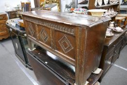 An antique oak coffer, having carved panelled front, late 18th Century, 127cm