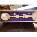 Chinese ivory ball on figural stand, a Chinese cribbage board and other items