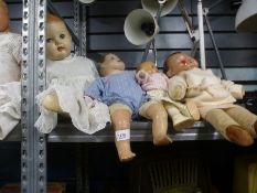 Five vintage playworn dolls, clothed