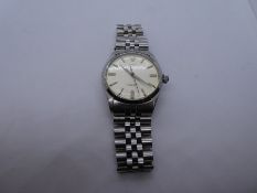 Vintage stainless steel 'Rolex' Oyster Perpetual, winds and ticks, surface scratches on a stainless