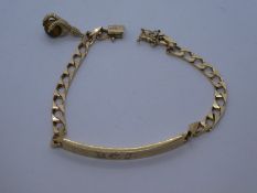 9ct yellow gold identity bracelet, hung with a single charm of a claw and tigers eye ball, 14.7g app