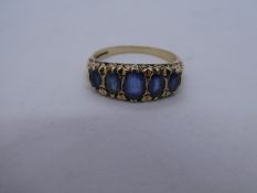 9ct yellow gold ring inset with graduated pale blue oval sapphires, marked 375, 3.6g approx, size Q