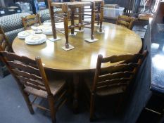 Titchmarsh & Goodwin, a large oak two flap gateleg table, 182 cm and a set of 8 wavy ladderback dini