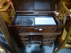 A Bang and Olufsen music system in reproduction mahogany case in form of deck