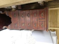 A wooden nest of 3 tables and a wooden miniature storage unit of 2 small over 4 long drawers