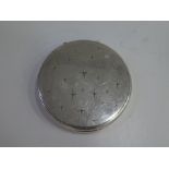 A decorative sterling silver compact mirror decorated with pretty stars. A decorative, ornate piece