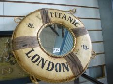 Two cased pictures of Nautical knots and a round mirror marked Titanic