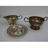 A silver porringer with beaded rim and pot, with pedestal base. Two handled, hallmarked Birmingham 1