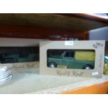 Two metal hand painted display models of a Land Rover and a Jeep