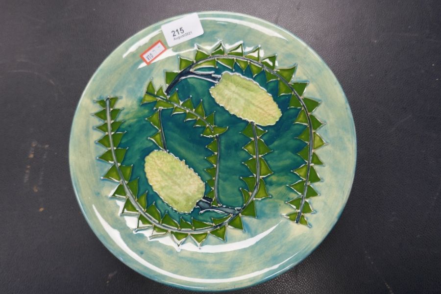 A Moorcroft circular plate, green glazed, 26cm
