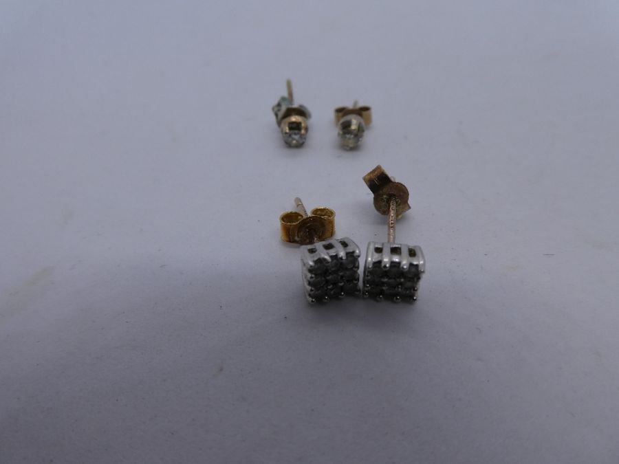 Pair of 9ct yellow gold diamond chip square cluster earrings and unmarked gold pair of diamond studs