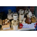 A large quantity of stoneware bottles and canisters