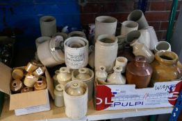 A large quantity of stoneware bottles and canisters