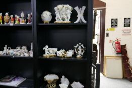 Three shelves of Moore Brothers cherub figures and similar