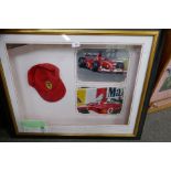 A framed baseball cap signed by Ferrari F1 Champion Michael Schumacher and Rubens Barrichello in 200