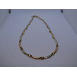 14ct two tone necklace, the links banana shaped, marked 585, to clasp, 44cm, 15.7g approx