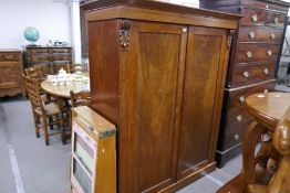 Victorian mahogany linen cupboard having pair of panelled doors on plinth base, 138cm