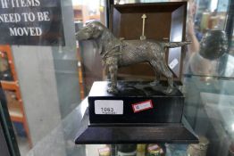 Bronze Retriever dog on base and a Cadbury clock in the shape of a square of chocolate