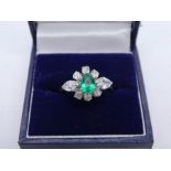 Pretty 1940s Platinum dress ring with central pear shaped natural Emerald surrounded by 6 round cut