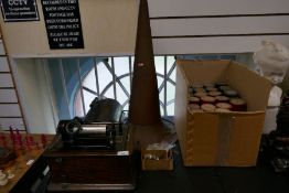 An Edison phonograph in oak domed case with copper trumpet and a box of cylinders/records (over 40)