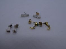 Pair of 18ct earrings set with baguette cut diamonds and two pairs of 9ct yellow gold studs