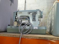 Jones cased electric sewing machine, with instructions, and a boxed new Dunelm Mill floor standing l