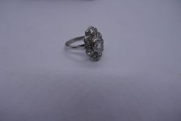 Pretty unmarked scalloped Art Deco diamond dress ring with central diamond, approx 1 carat. Some dis