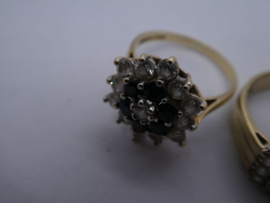 Two 9ct yellow gold dress rings, one a cluster example, marked 375, sized P & N, approx 7g - Image 2 of 5