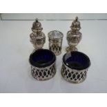 A pierced pair of two silver salts with Bristol blue inset, and a pair of decorative, pretty and orn