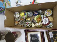 A box of trinket pill boxes depicting mainly birds and flowers