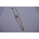 9ct yellow gold neckchain hung with a pendant set with pear shaped pink stone, chain marked 9ct,