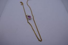 9ct yellow gold neckchain hung with a pendant set with pear shaped pink stone, chain marked 9ct,