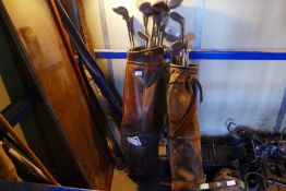 Two vintage golf sets in bags with wooden and metal clubs