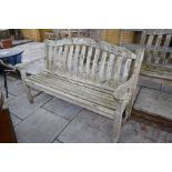 A solid large teak garden bench