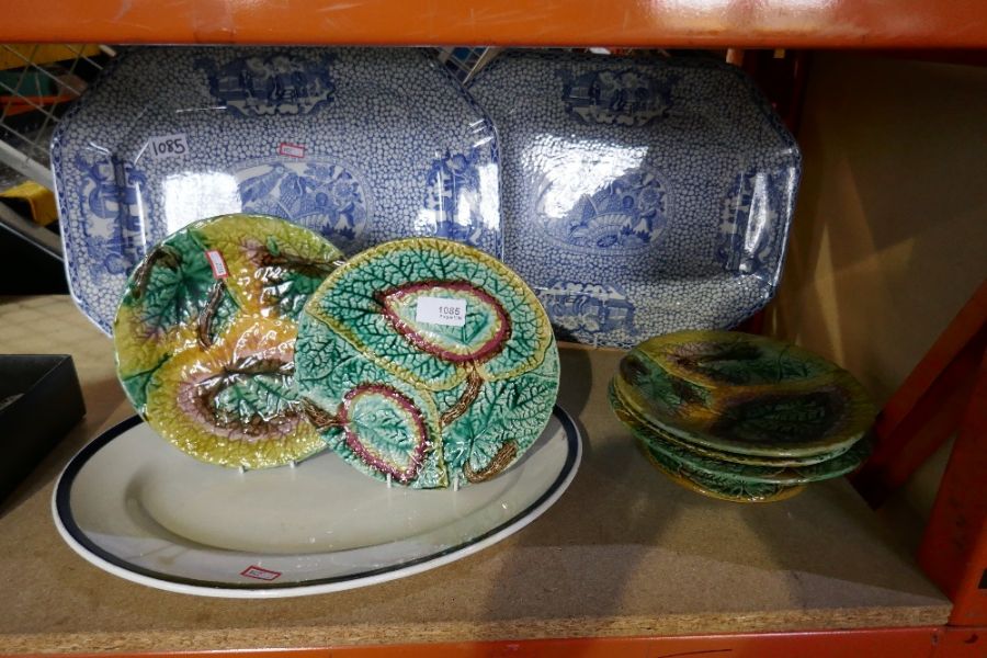 Two blue and white charger plates, 4 green leaf design plates and a cake plate