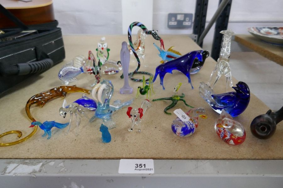 A quantity of coloured glass animals and similar