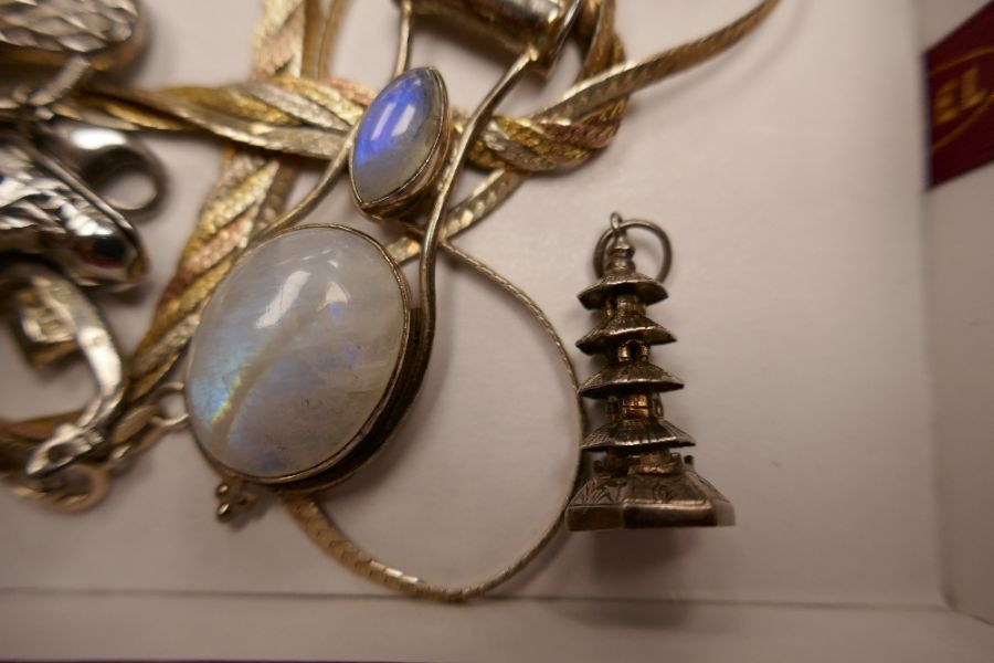 A collection of silver charms, to include a WANG HING example, a silver moonstone pendant, etc - Image 2 of 2