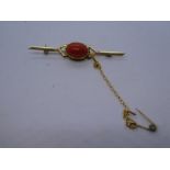 18ct yellow gold bar brooch with safety chain and oval cabochon orange hardstone, marked 750, 3.1g