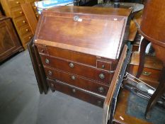 Antique mahogany inlaid bureau with fitted interior above 3 drawers