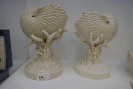 Beleek Nautilus shell centrepiece, with black stamped mark and other other slightly smaller example,